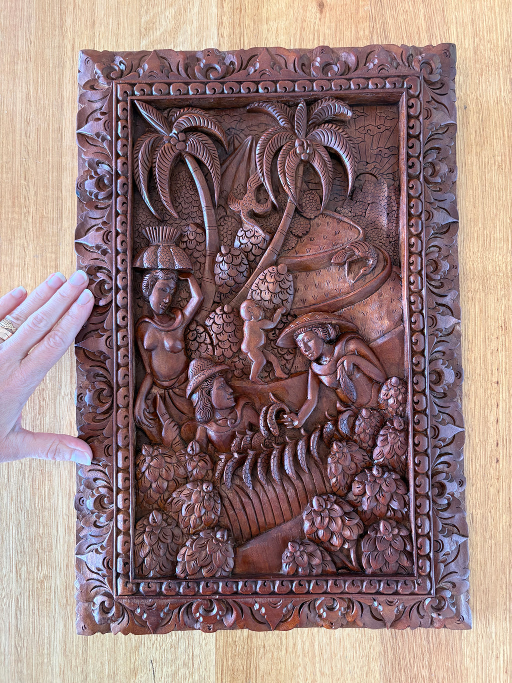 Traditional Balinese teak wood carving, harvest, vintage art